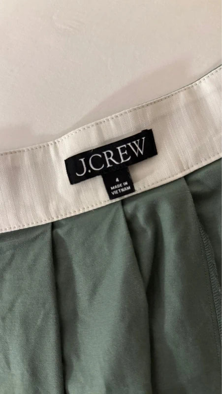 Green pleated mini skirt